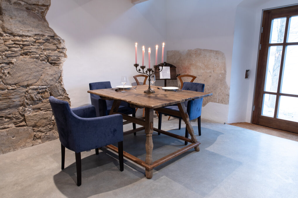 Eating table with candles and 3 comfortable chairs